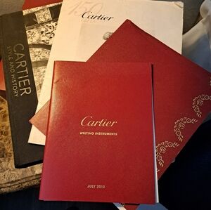 Cartier old books and Cartier large history book.